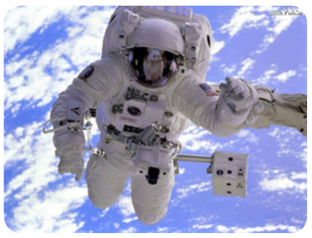 Figure 1.12: Weightlessness of astronauts_
Table 1.2: Apparent weight of a person in a moving lift#
| Case 1: Lift is moving upward with an acceleration ‘a’ | Case 2: Lift is moving downward with an acceleration ‘a’ | Case 3: Lift is at rest. | Case 4: Lift is falling down freely |
|---|---|---|---|
| R - W = F_net = ma_net R = W + ma R = mg + ma R = m(g+a) | W - R = F_net = ma